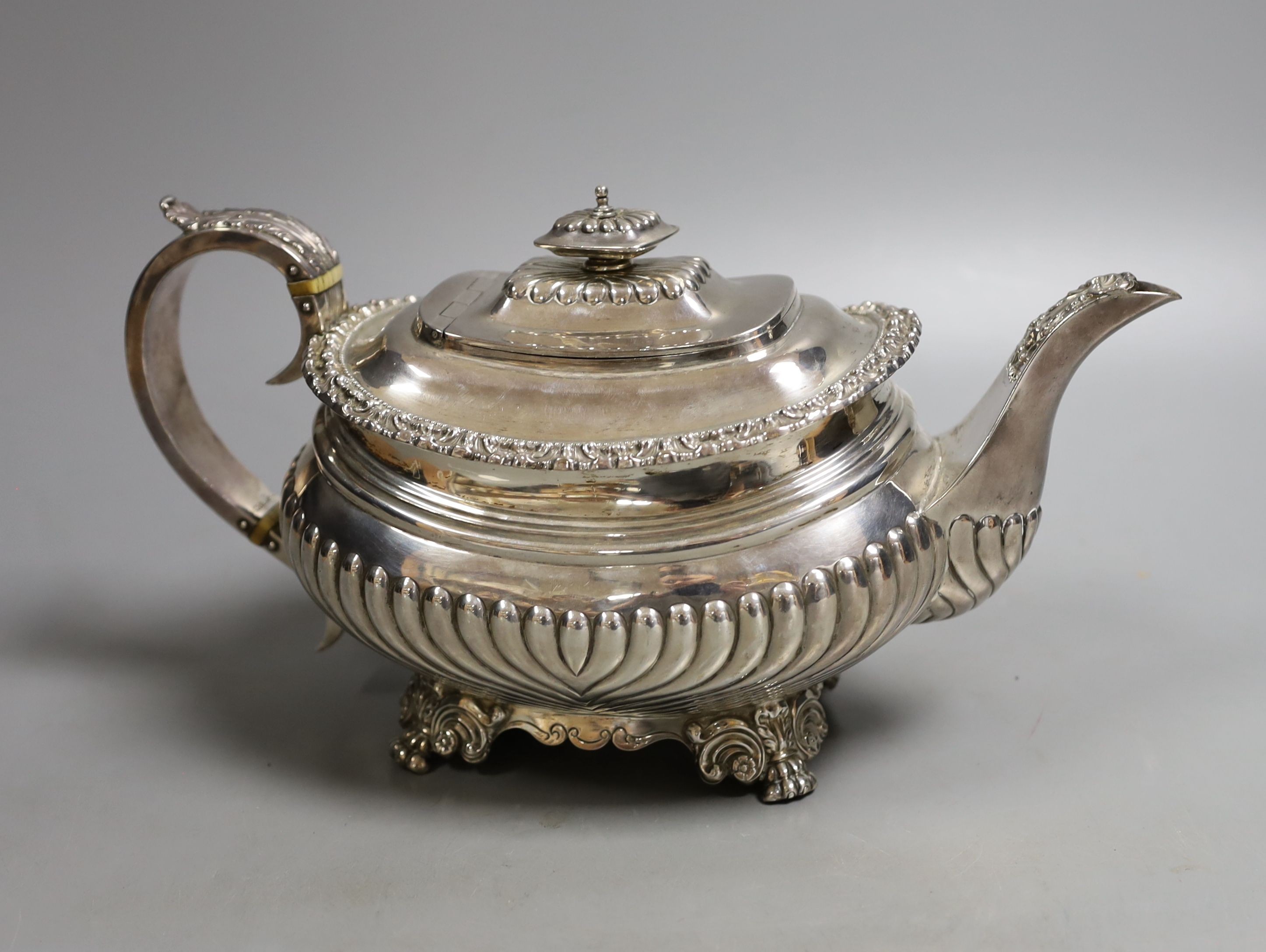 A George IV demi-fluted silver teapot, by John & Thomas Settle, Sheffield, 1824, gross weight 23.5oz (patch to base).
